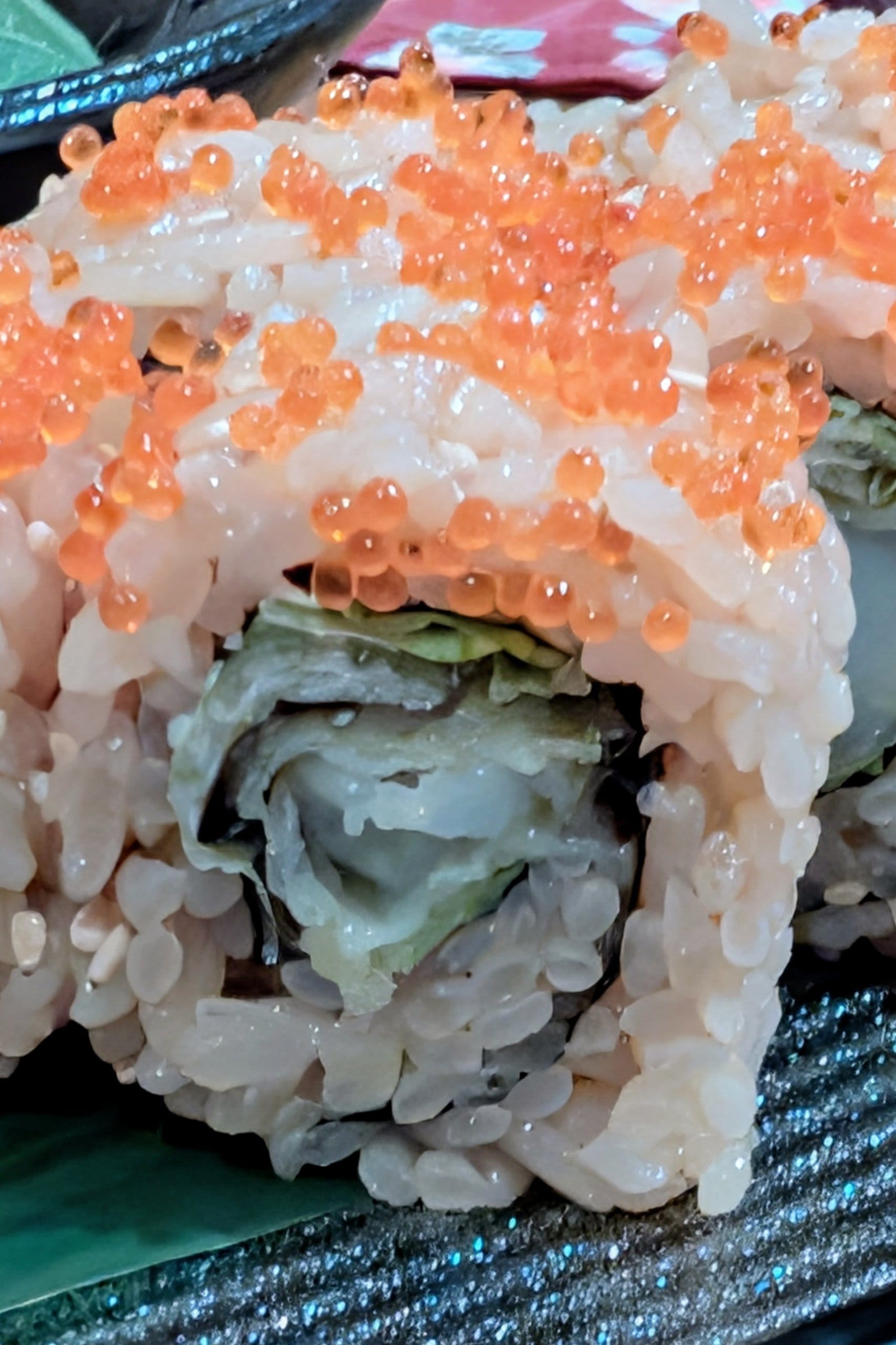 Close-up of a tobiko-topped sushi roll at Hanashizuku Singapore