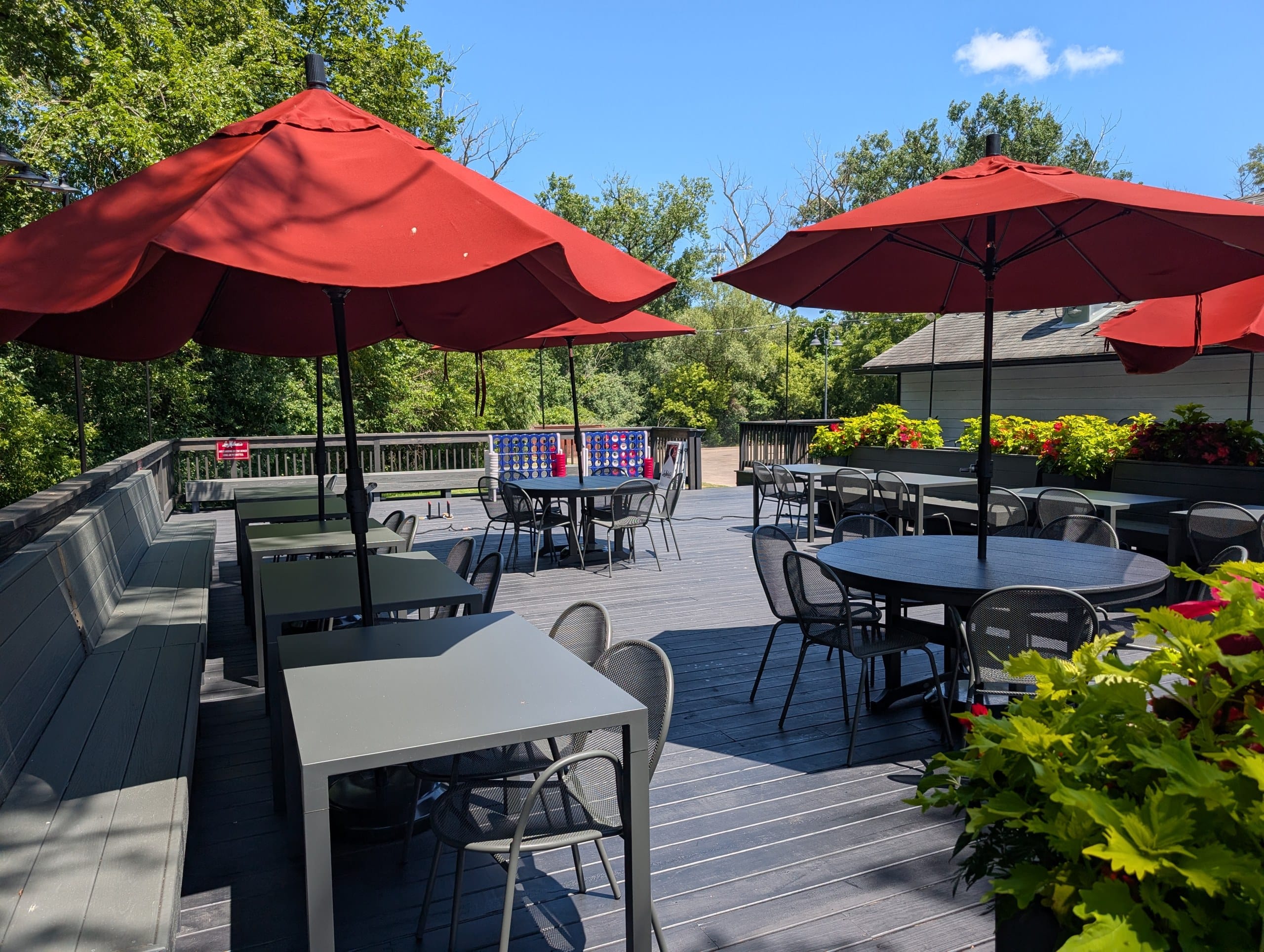 Red umbrellas over the tables on the new patio at Lou Malnati's Buffalo Grove