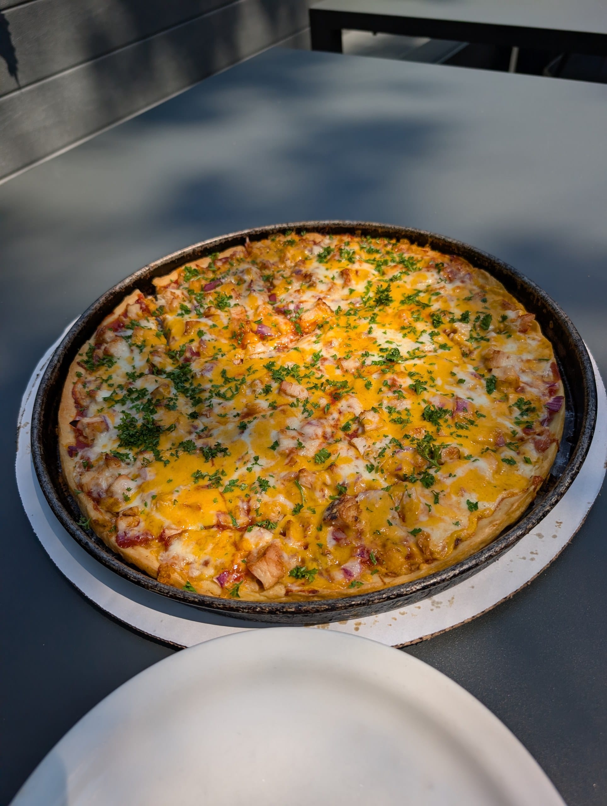 Large thin crust BBQ chicken pizza with cheddar and red onions at Lou Malnati's Buffalo Grove