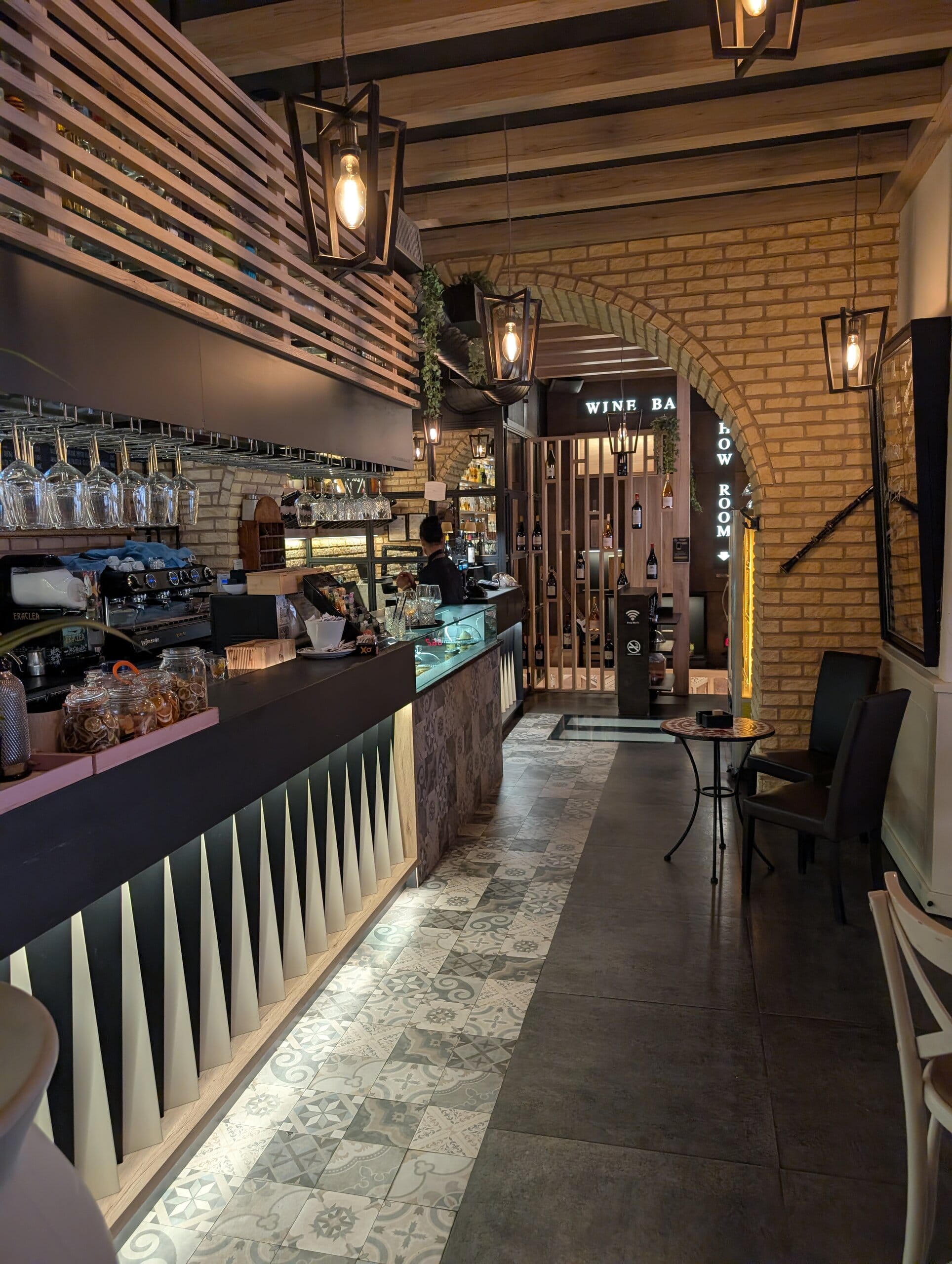 Bar room at Mylord in Civitavecchia with brick archways and espresso bar