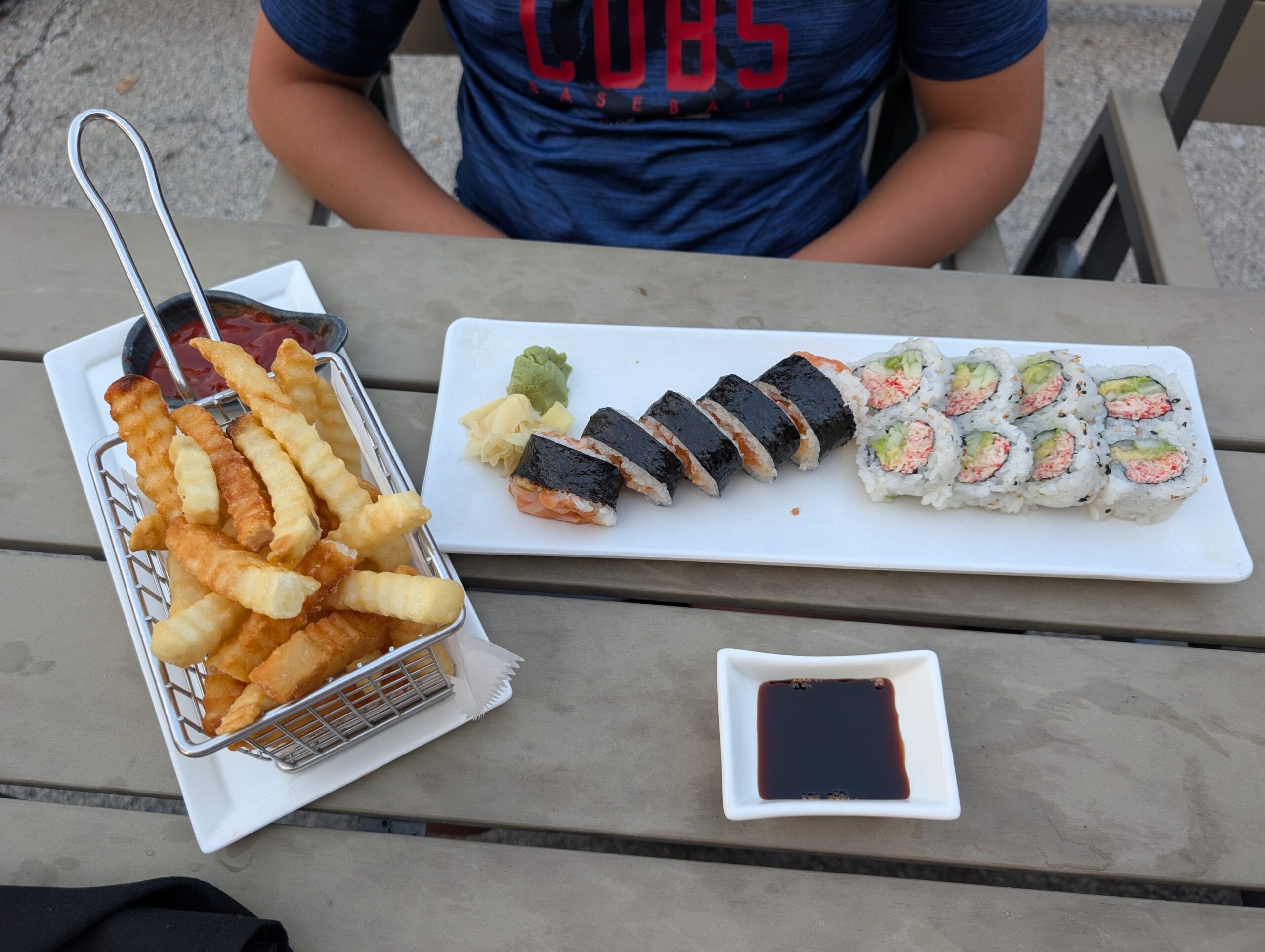 Kids sushi dinner at Shakou Arlington Heights with a basket of crinkle cut fries, spicy salmon roll and California roll