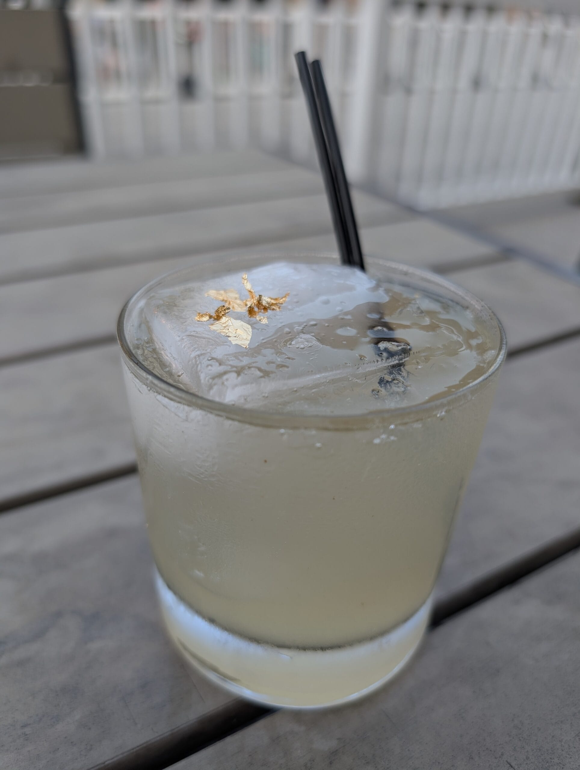 Kintaro cocktail at Shakou Arlington Heights with a large clear ice cube and edible gold flakes