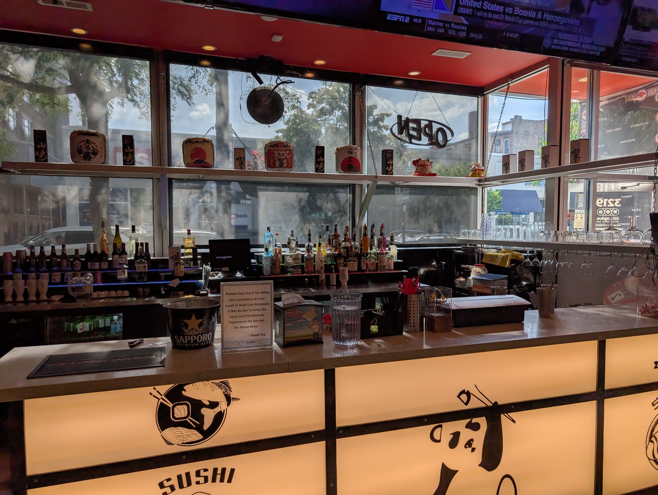 The bar at Sushi Plus with Japanese whisky on the back shelf