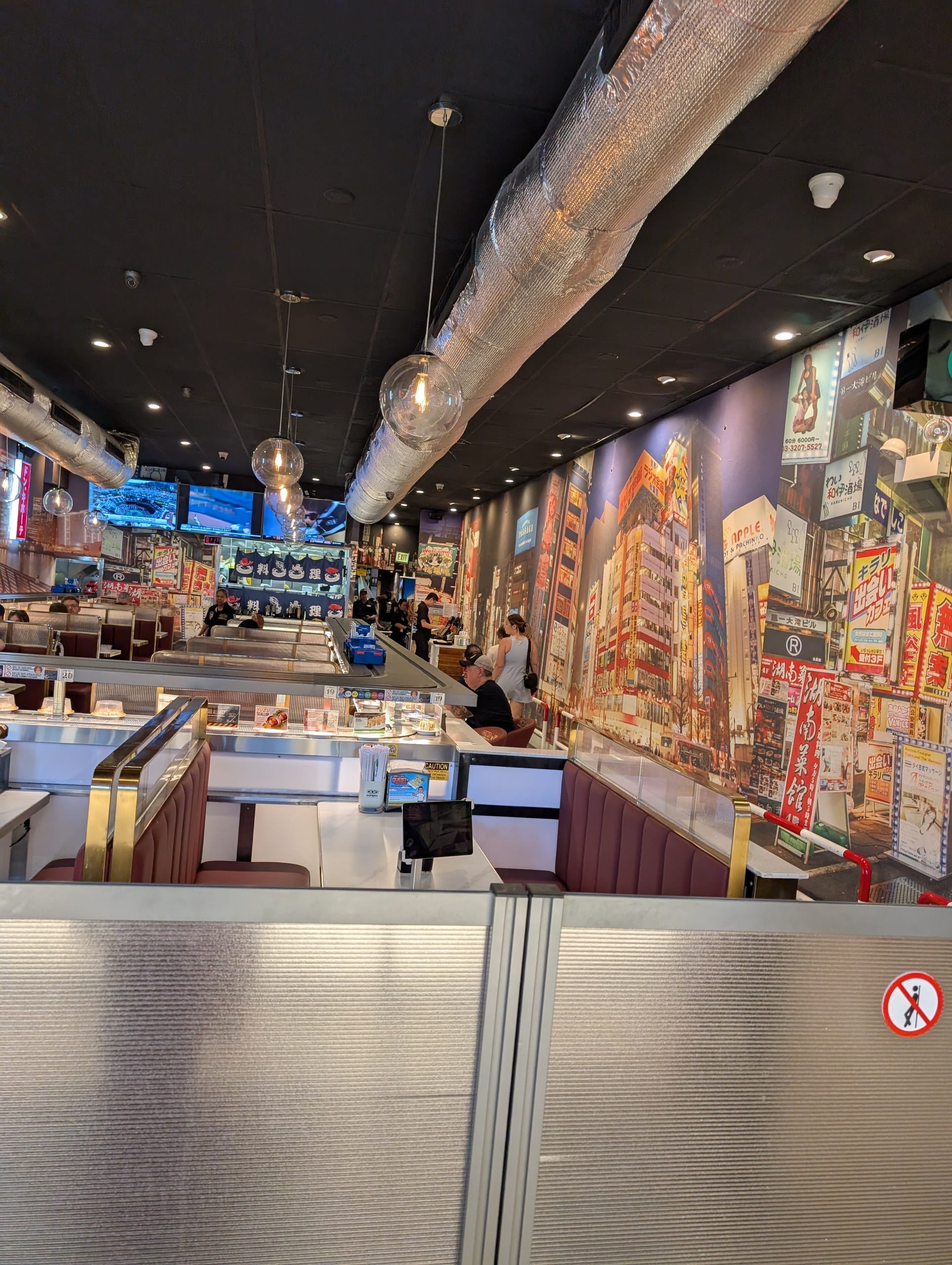 Booth seating along the conveyor belt at Sushi Plus