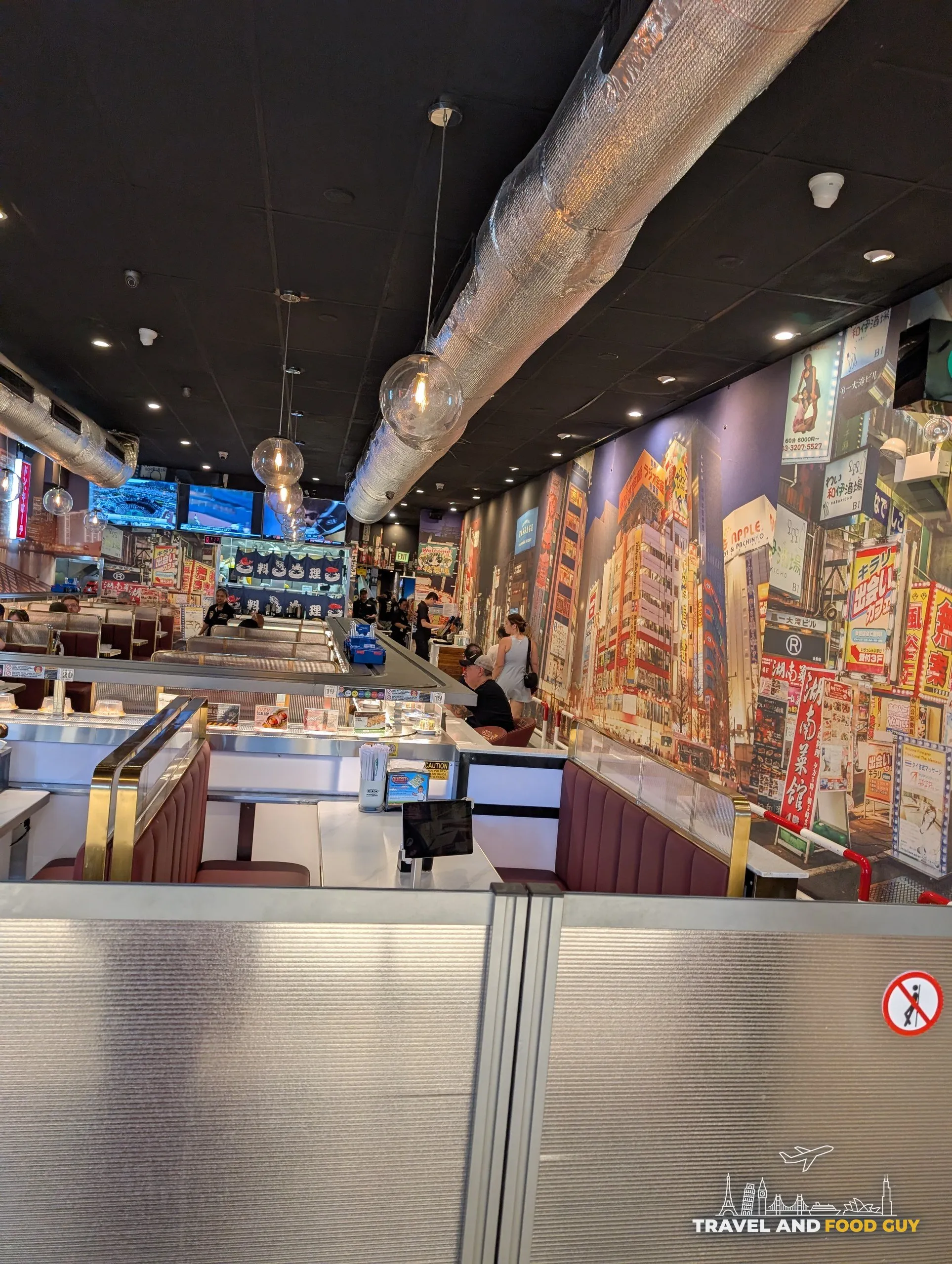Booth seating along the conveyor belt at Sushi Plus