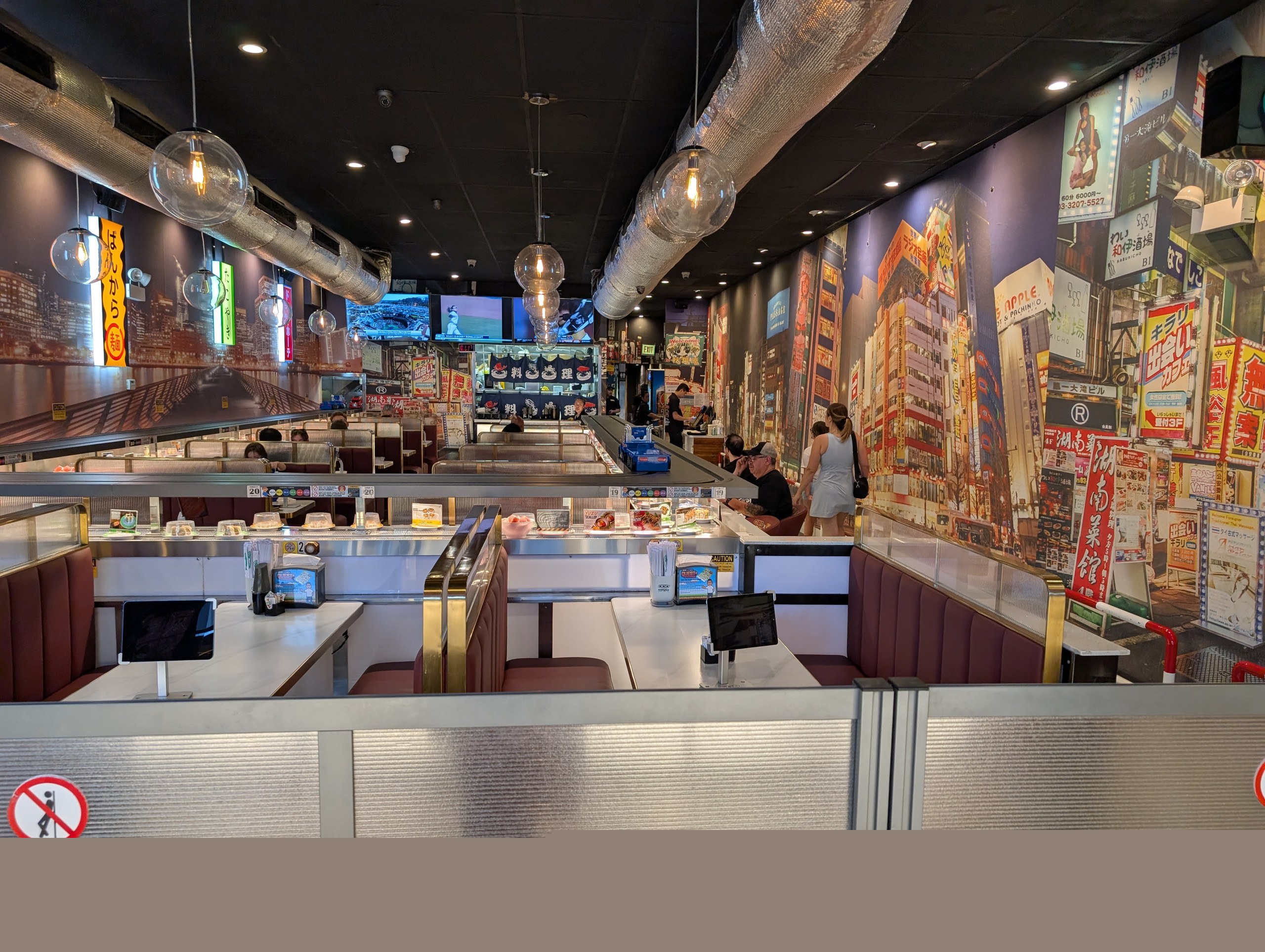 The dining room and conveyor belt at Sushi Plus in Chicago