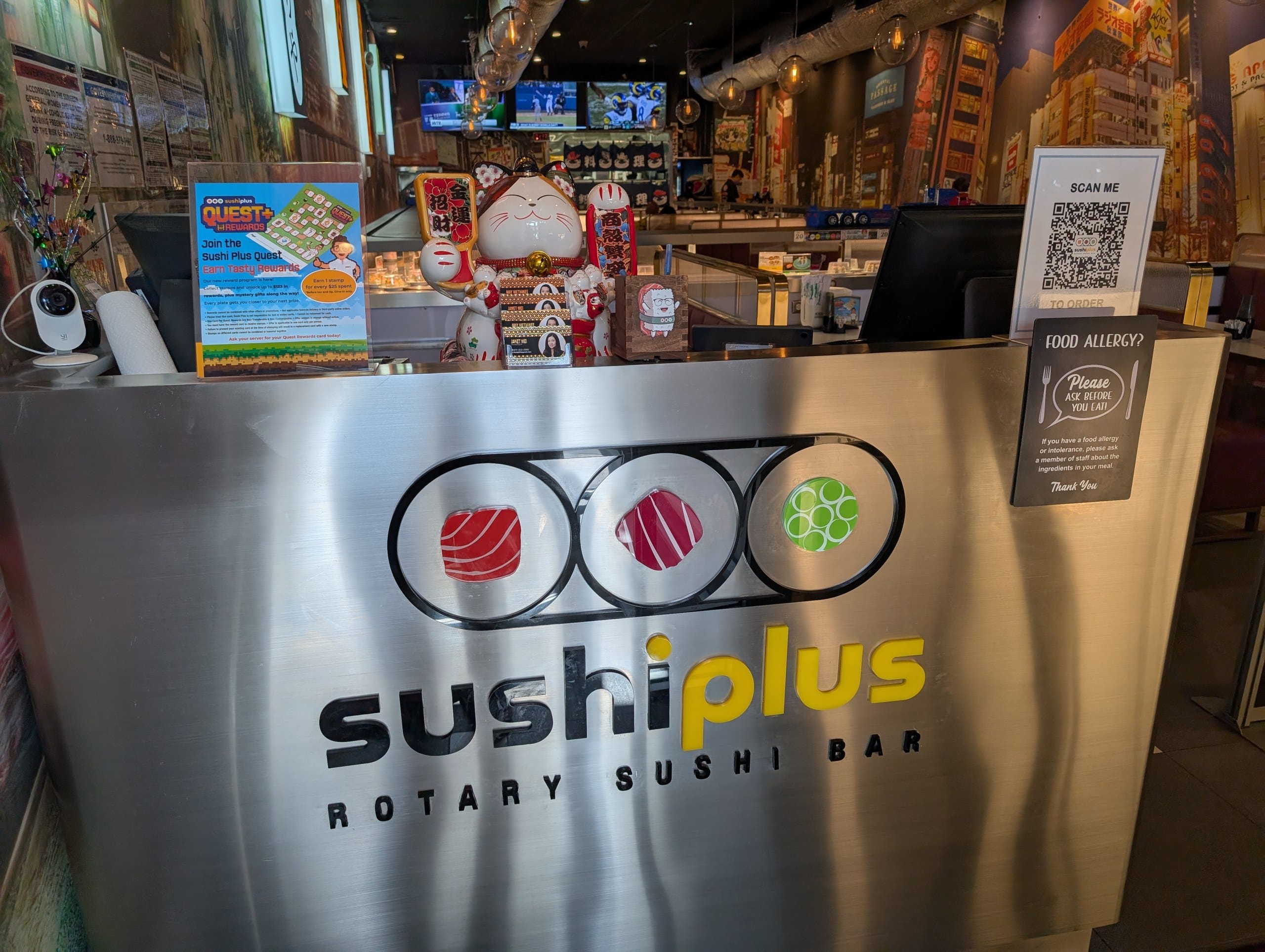 The host stand and interior of Sushi Plus Rotary Sushi Bar