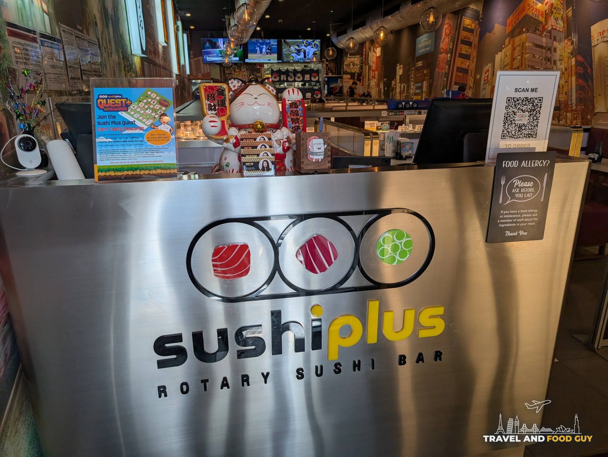 The host stand and interior of Sushi Plus Rotary Sushi Bar