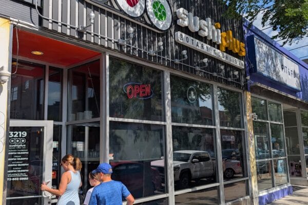 Sushi Plus Rotary Sushi Bar storefront on North Broadway in Chicago's Boystown