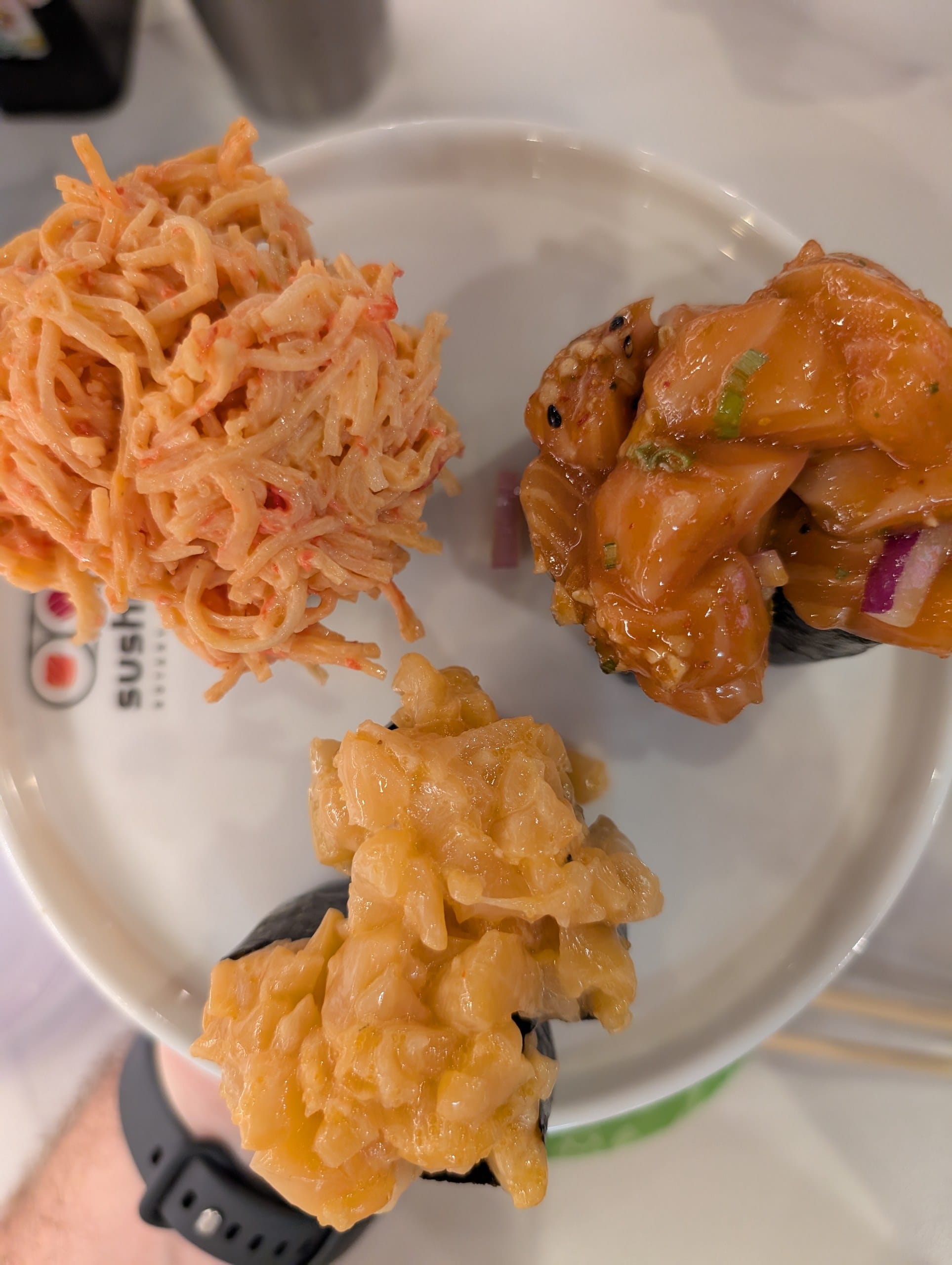 Spicy crab, sake poke, and spicy scallop gunkan at Sushi Plus