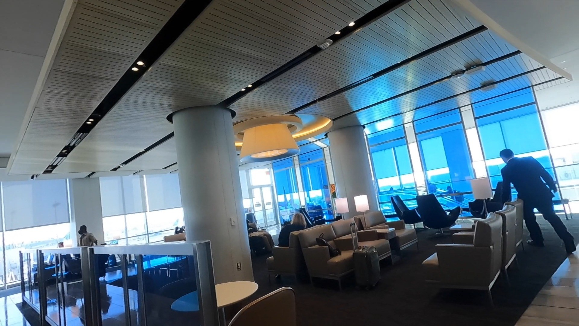 Armchair seating with table lamps at the United Club LAX