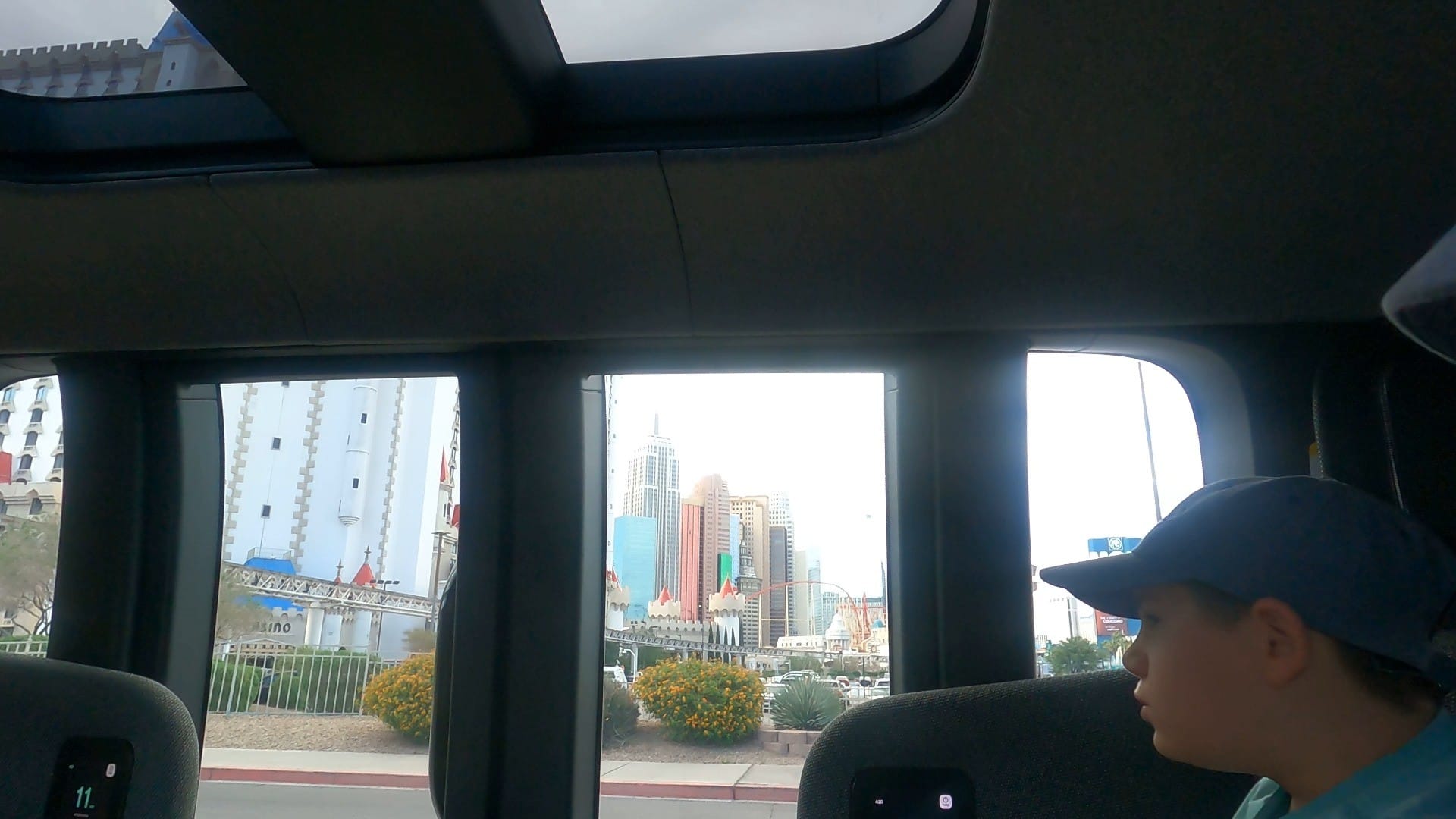 Inside a Zoox robotaxi with the Las Vegas Strip out the window
