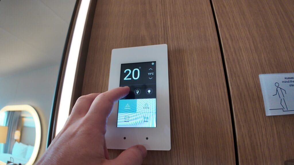 Cabin thermostat and lighting presets panel in a Legend of the Seas stateroom