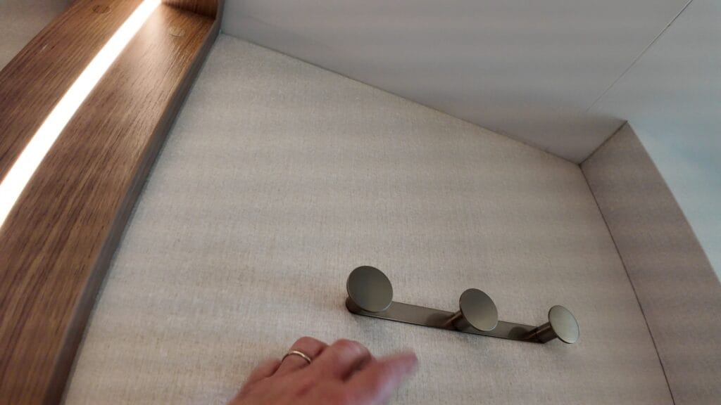 Wall hooks just inside the door of a Legend of the Seas balcony stateroom