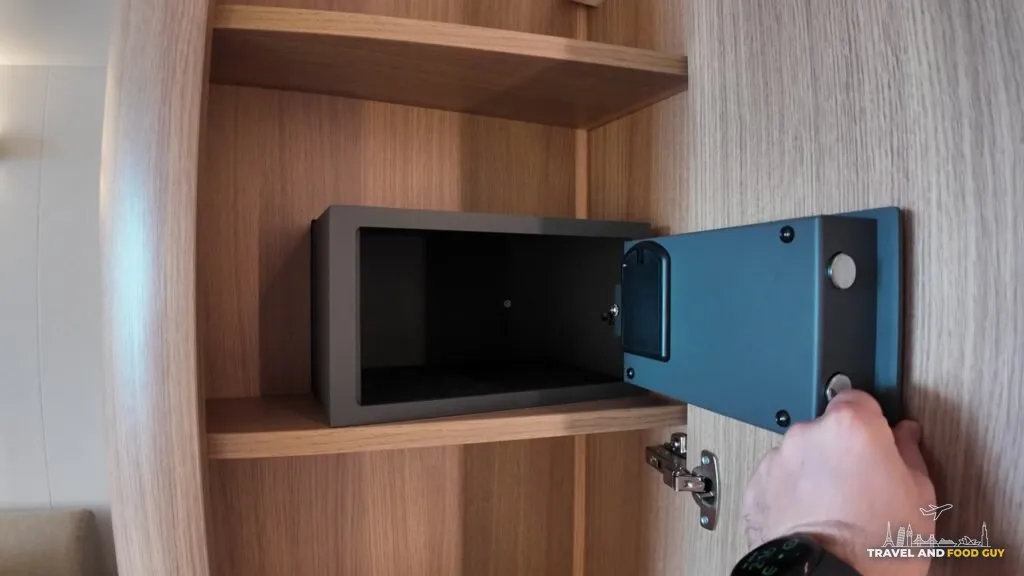 The in-room safe in a Legend of the Seas ocean view balcony stateroom, open