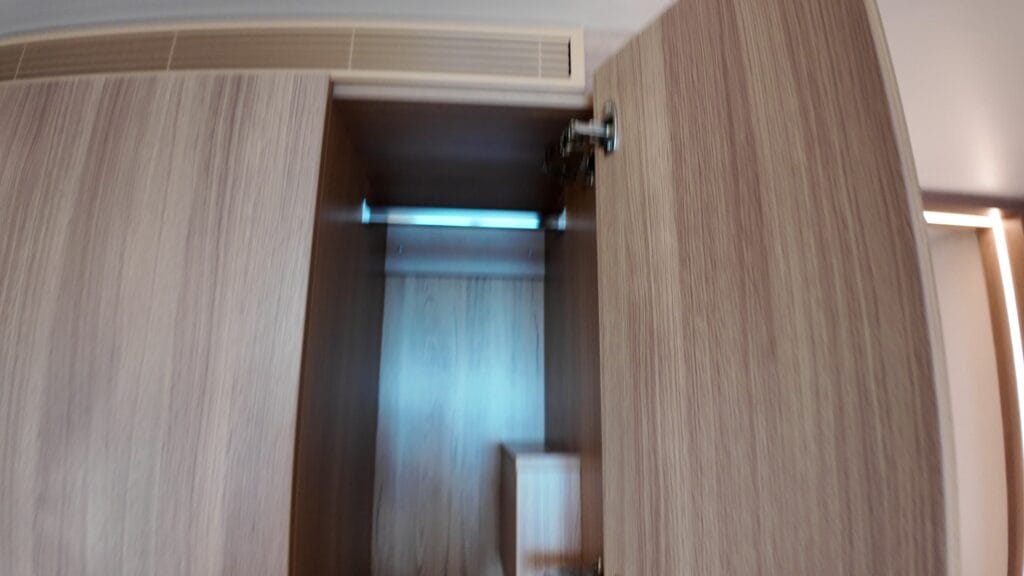 Full height closet section for long dresses with wire basket shelving below