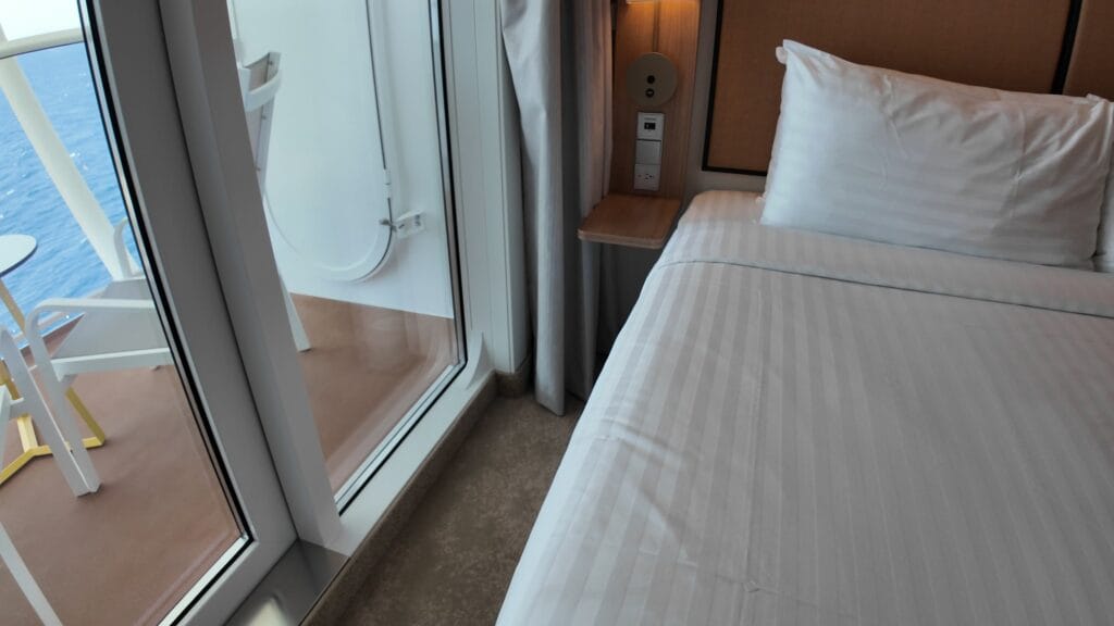 The second nightstand with a US power socket in a Legend of the Seas stateroom