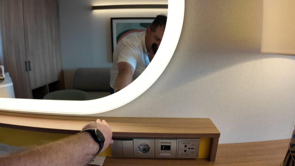 Desk power plate with European adapter, USB and USB-C in a Legend of the Seas stateroom