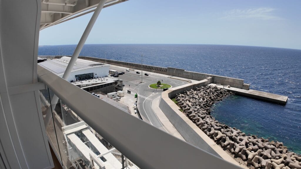 The view from a deck 14 ocean view balcony on Legend of the Seas in port