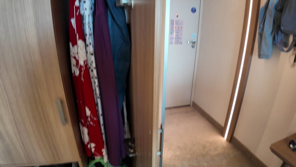 The wardrobe in stateroom 14632 fully unpacked with a week of clothes