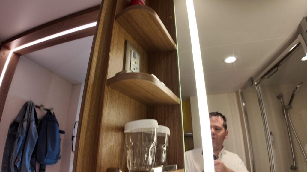 Bathroom shelving still partly empty after unpacking toiletries