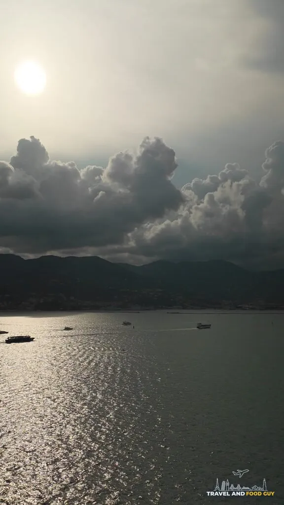 Sunrise over the water seen from a Legend of the Seas balcony approaching La Spezia