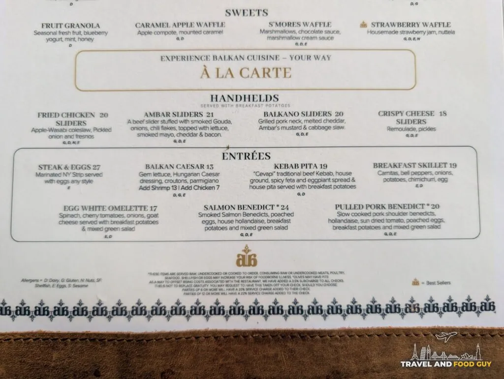 The reverse of the menu lists the a la carte option, including Ambar sliders at twenty one dollars, pulled pork benedict at twenty and steak and eggs at twenty seven.
