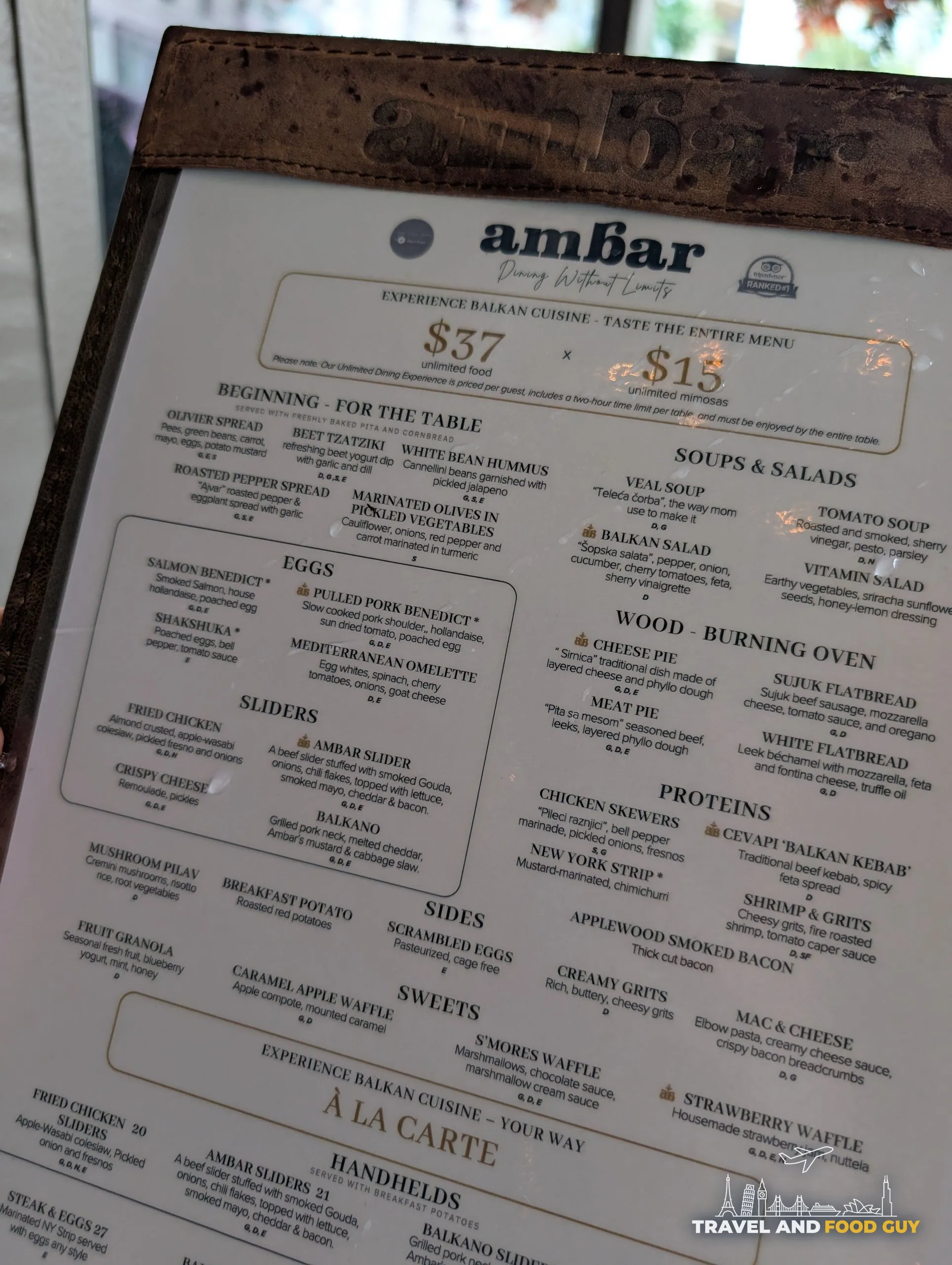 The brunch menu prices the unlimited experience at thirty seven dollars for food and fifteen dollars for unlimited mimosas, above the full list of Balkan plates.