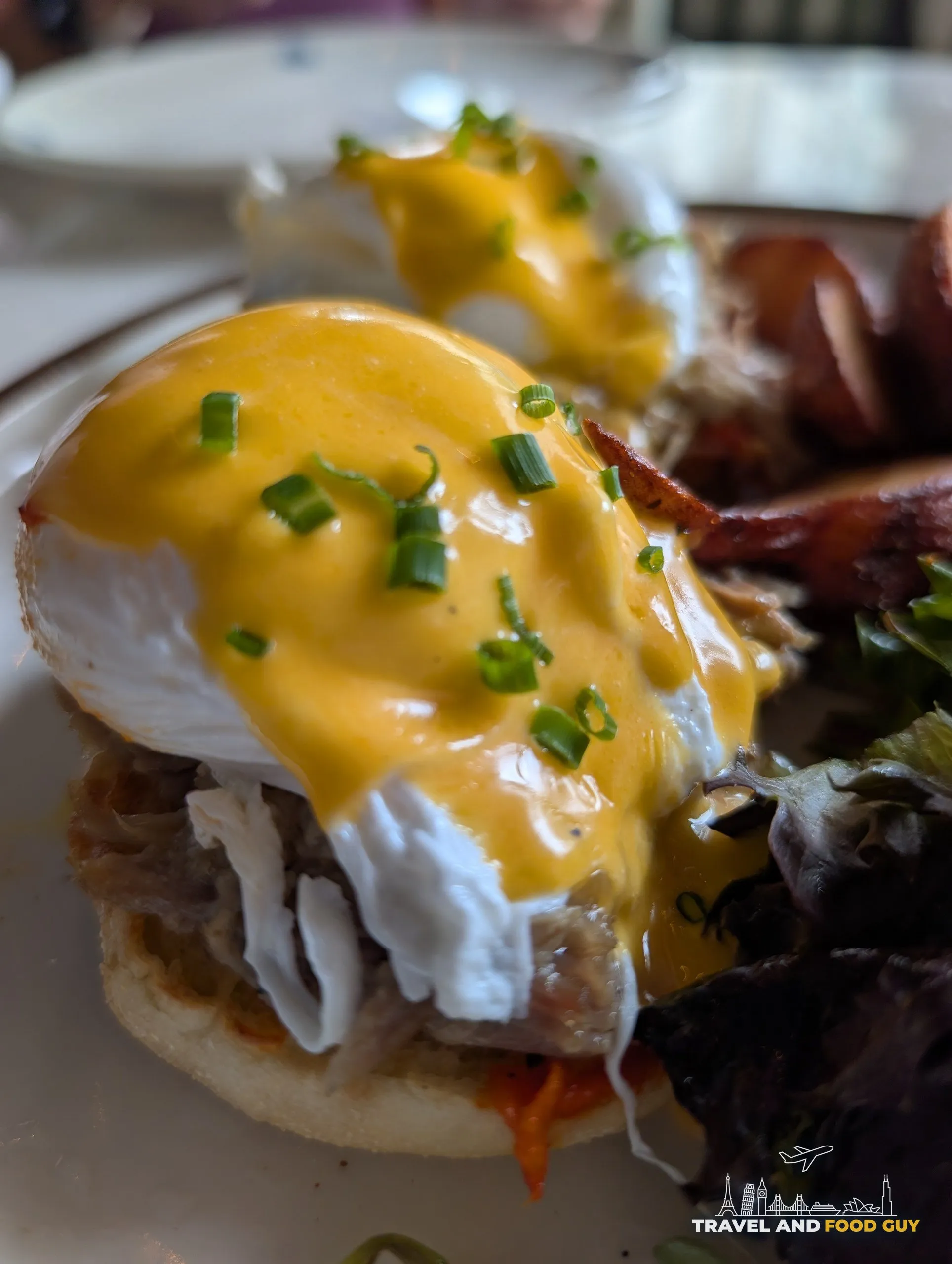 The pulled pork benedict comes with poached eggs and hollandaise over slow cooked pork shoulder, with breakfast potatoes and a mixed green salad.