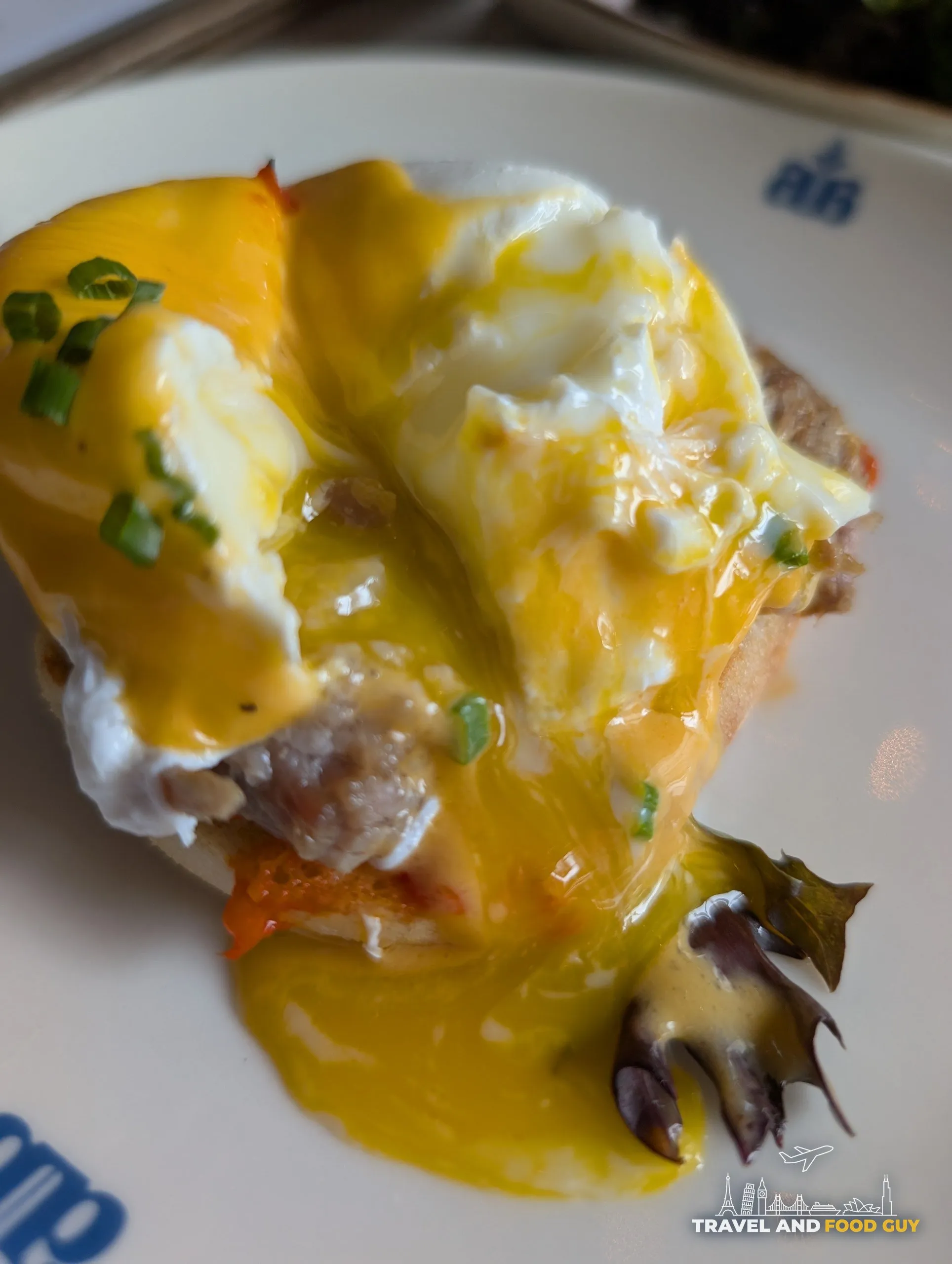 The yolk runs across the plate once the poached egg is cut, over hollandaise, sun dried tomato and the pulled pork beneath.