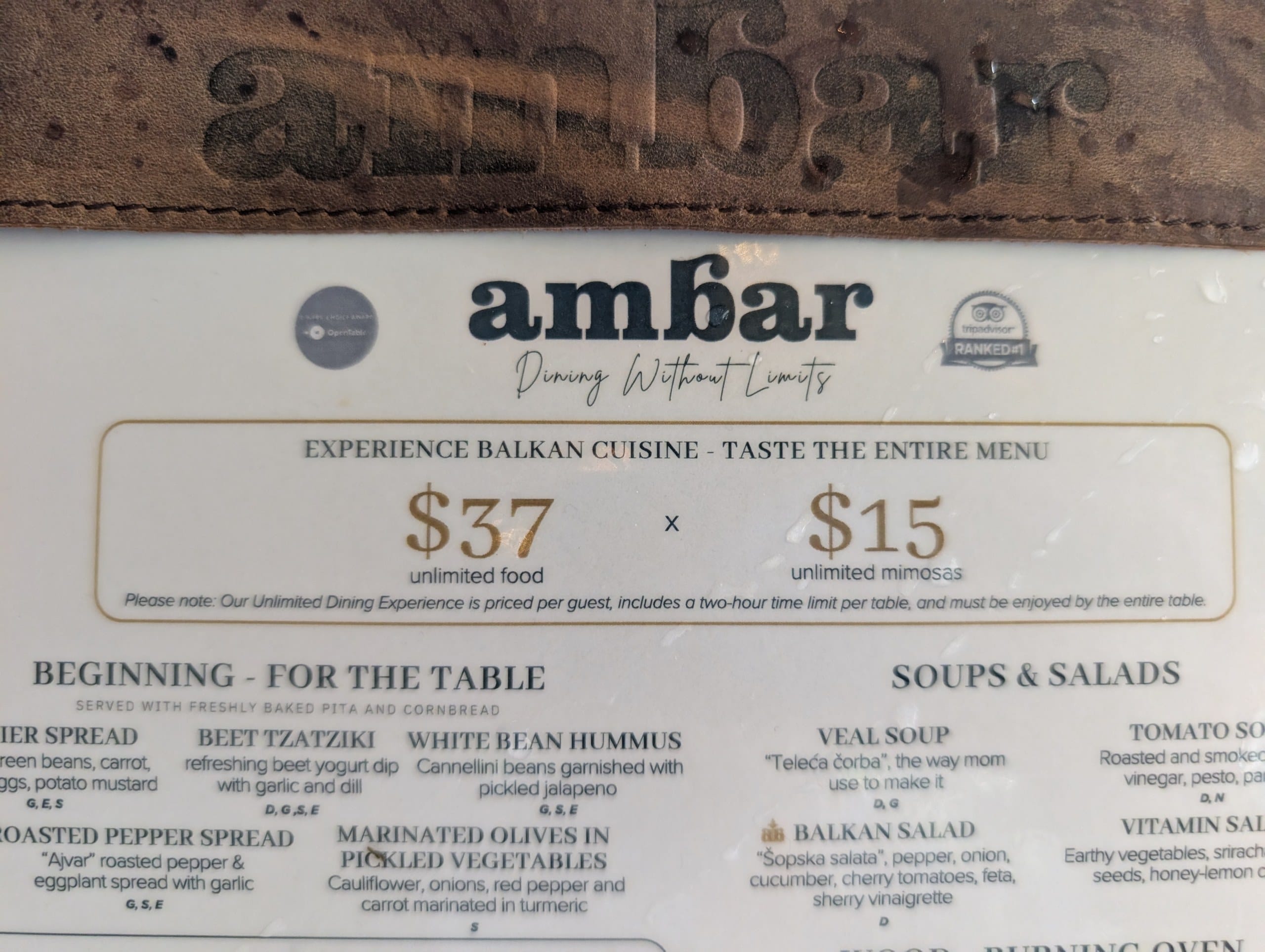 The fine print on the brunch menu states the unlimited experience is priced per guest, carries a two hour table limit, and must be taken by the entire table.