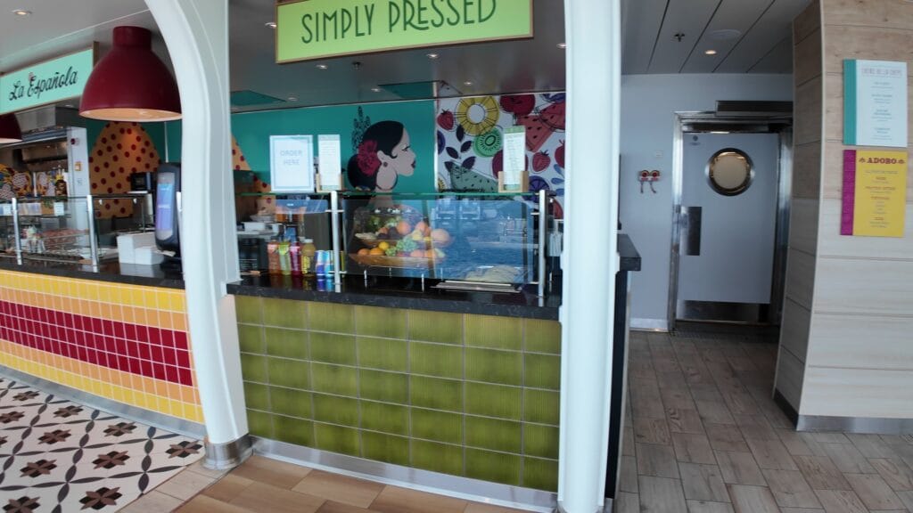 The AquaDome Market counter on Legend of the Seas, with the Simply Pressed juice bar and La Espanola stands, empty on embarkation day.