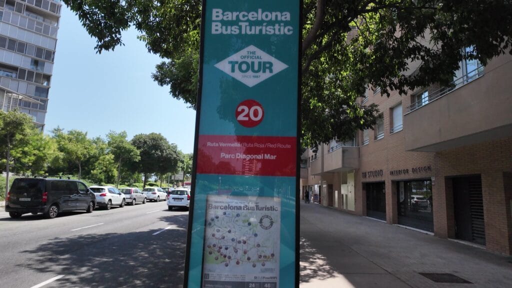 A Barcelona Bus Turistic hop on hop off stop totem showing stop 20 on the Red Route at Parc Diagonal Mar, with the route map and 24 and 48 hour ticket prices