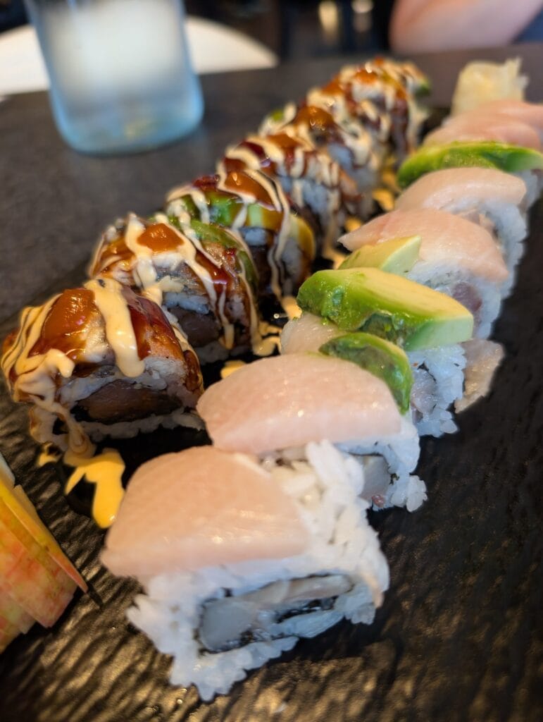 The Fire Dragon with eel and chili alongside the Hamachi Aisiteru, served together on slate.