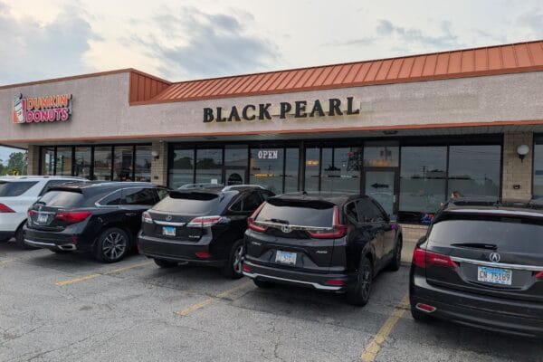 The Black Pearl sign above the storefront on North Milwaukee Avenue in Glenview, in the strip mall it shares with a Dunkin.