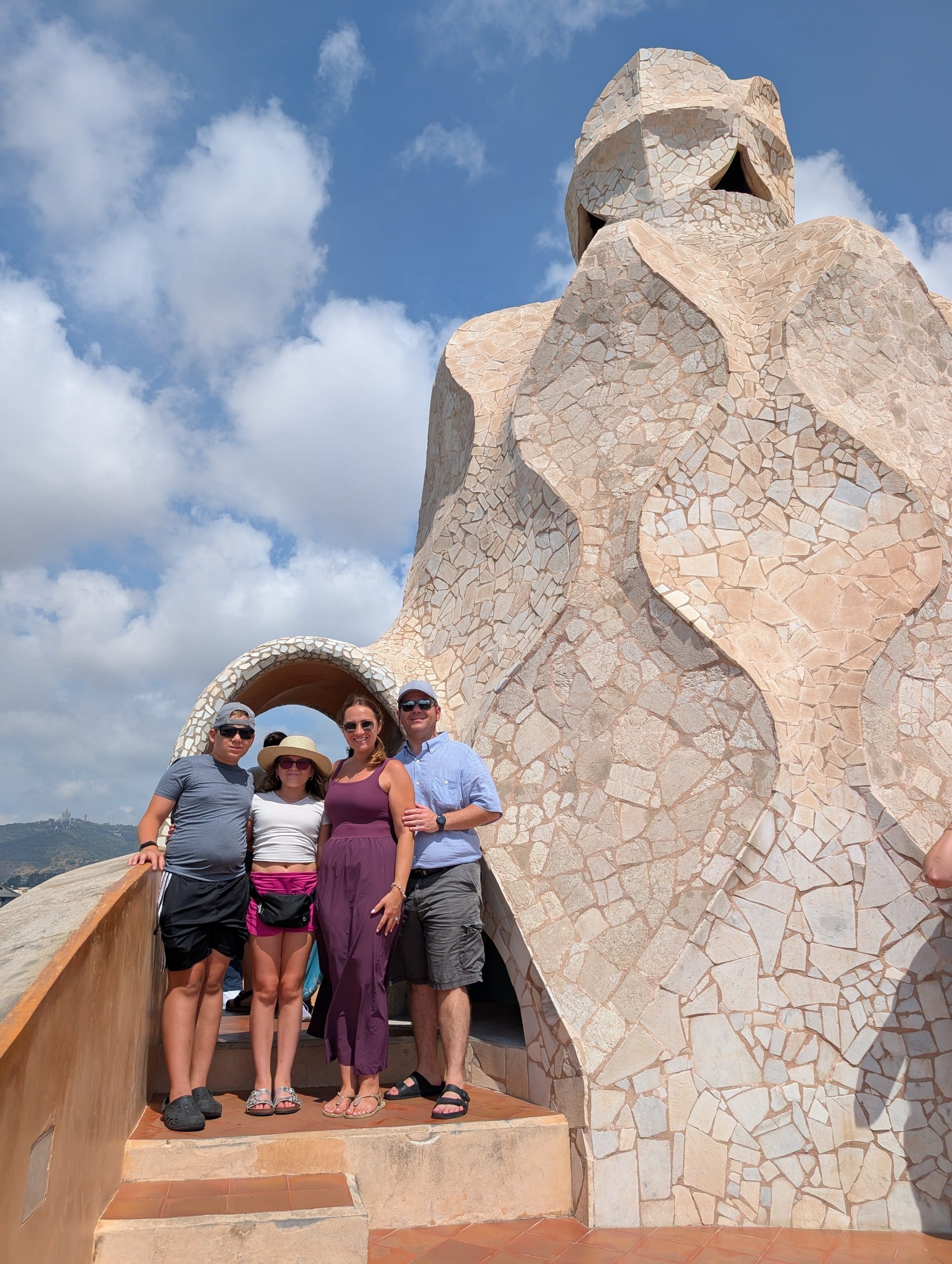 Alex, Vika, Josh and Emily on the Casa Milà rooftop beside a mosaic chimney