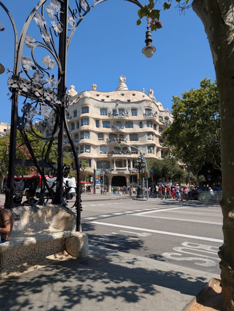Casa Mila, La Pedrera, framed through a Modernista streetlamp from the tuk tuk