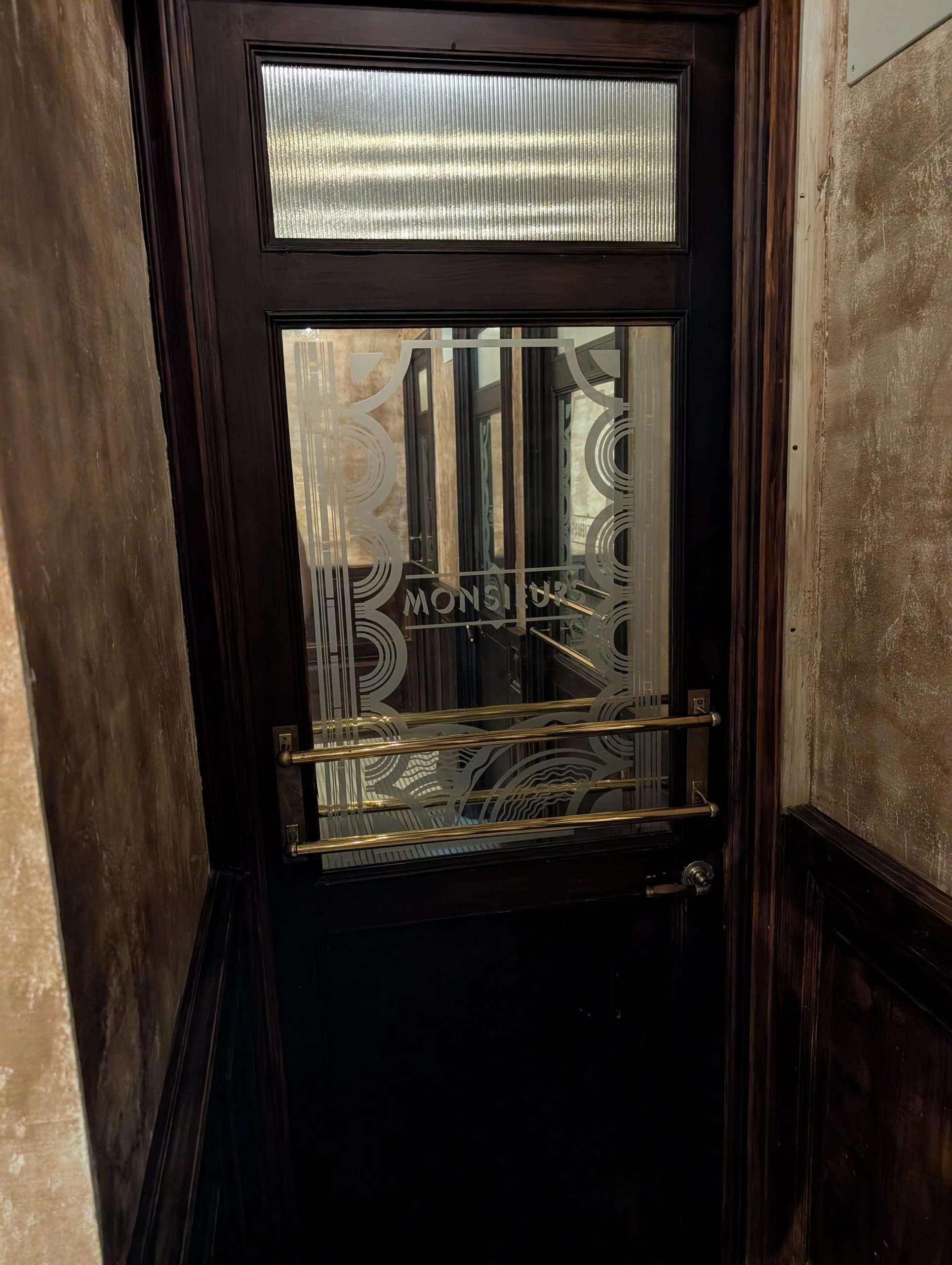 Etched glass door detail at Cheri Barcelona