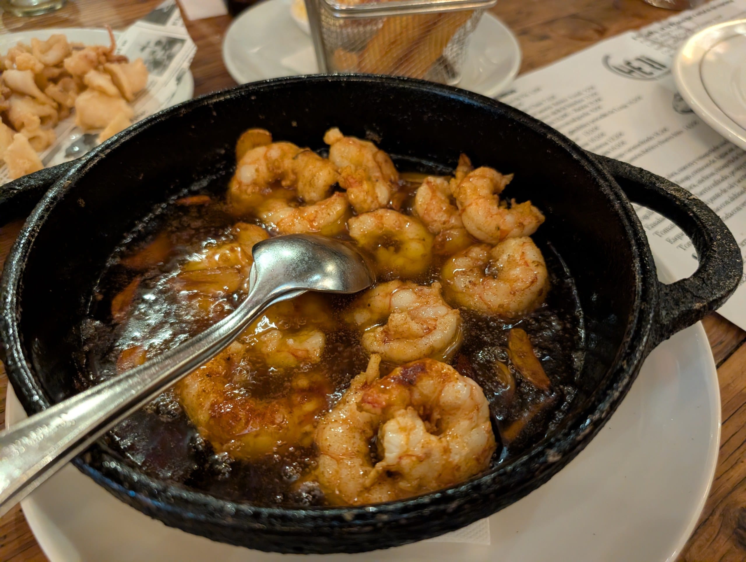 The garlic prawns at Cheri Barcelona, cooked in oil at the table