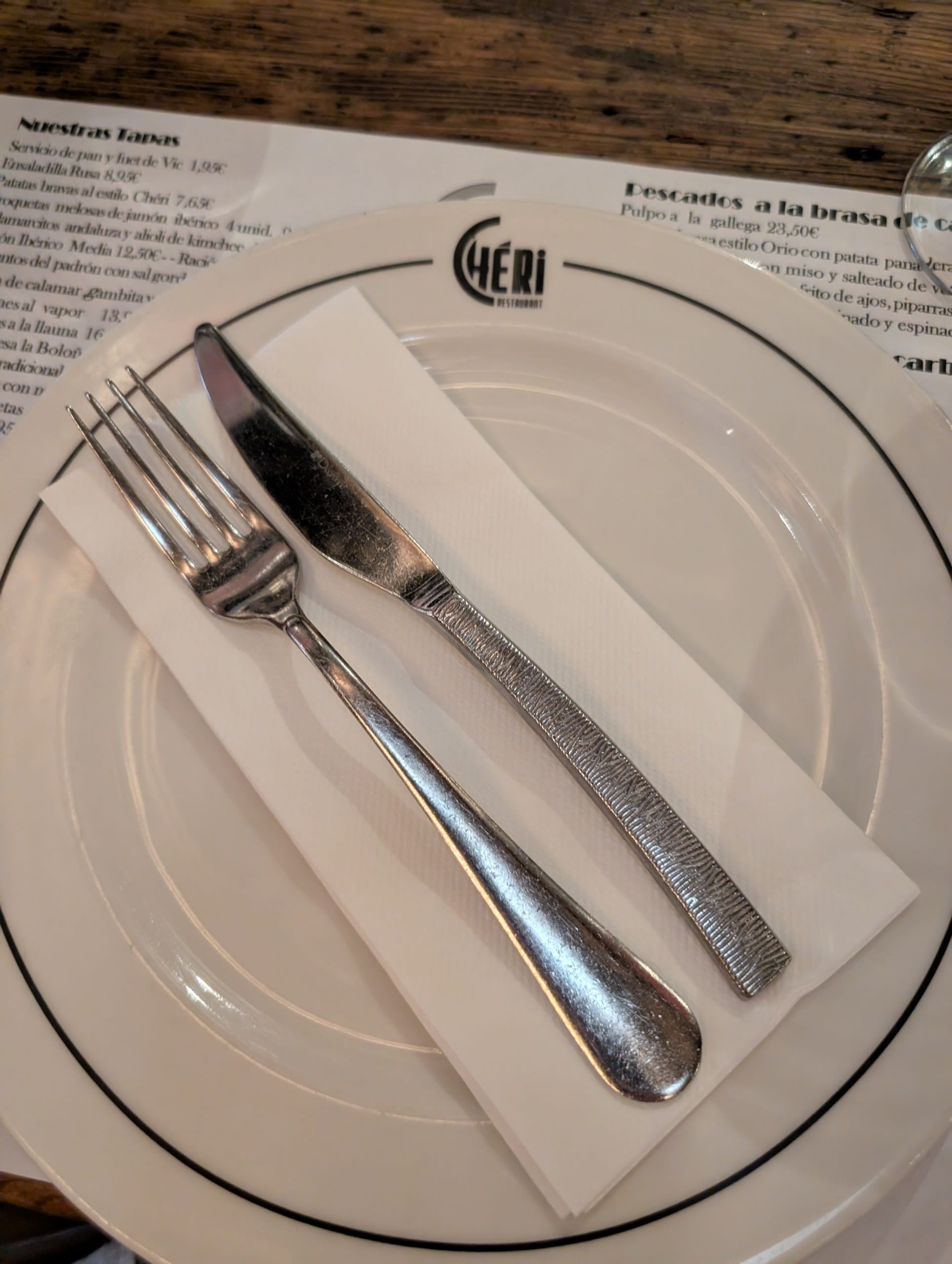 A place setting at Cheri Barcelona with the house monogram