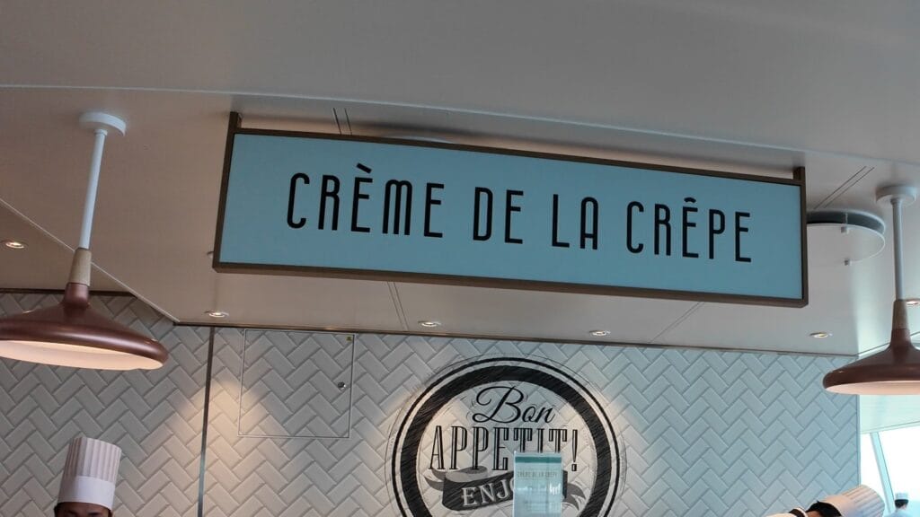 The Creme de la Crepe sign and Bon Appetit wall graphic at the crepe stand in the AquaDome Market.