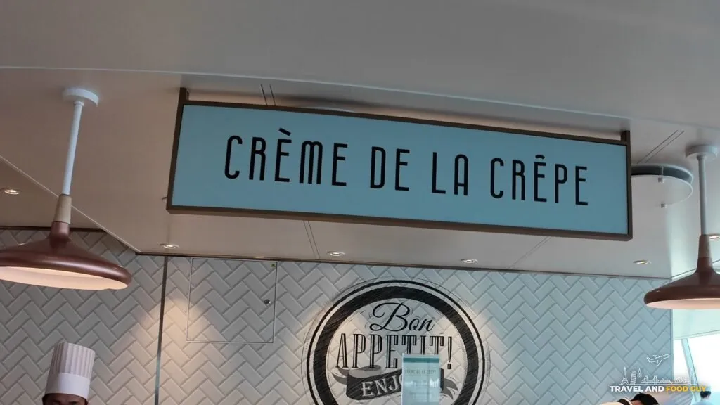 The Creme de la Crepe sign and Bon Appetit wall graphic at the crepe stand in the AquaDome Market.