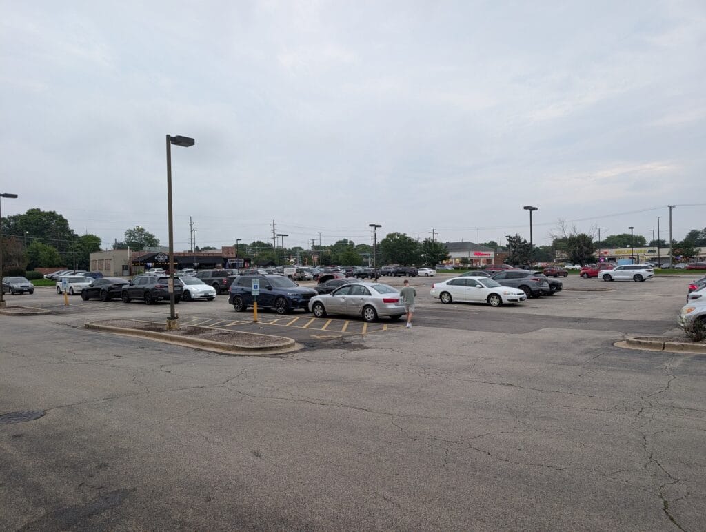 The strip mall parking lot on West Golf Road that e Sushi shares with a Walgreens and other Mount Prospect storefronts.