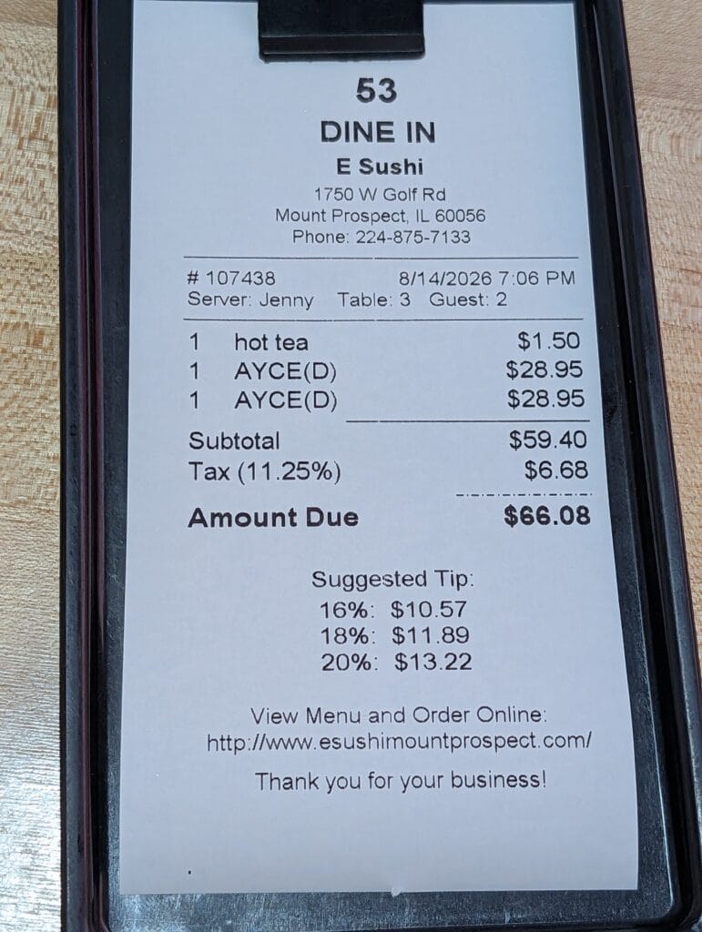 The check at e Sushi for two: two all you can eat dinners at 28.95 dollars each and a hot tea at 1.50, subtotal 59.40 dollars, tax 6.68, amount due 66.08.
