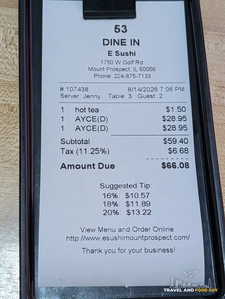 The check at e Sushi for two: two all you can eat dinners at 28.95 dollars each and a hot tea at 1.50, subtotal 59.40 dollars, tax 6.68, amount due 66.08.
