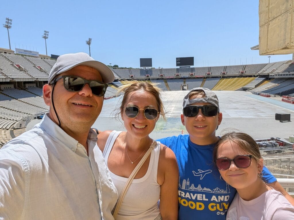 Family selfie inside the Olympic Stadium on Montjuic during the tuk tuk tour