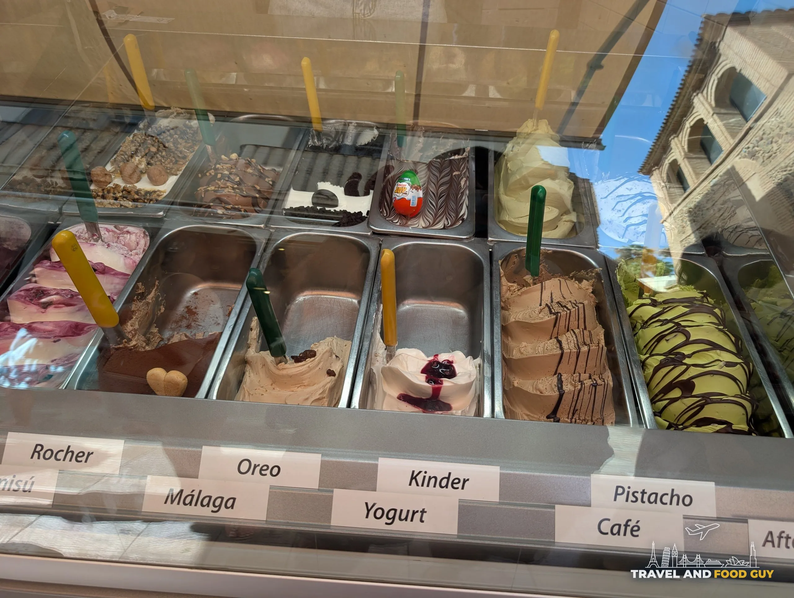 Gelato counter with trays of flavors at Freskitto in Málaga