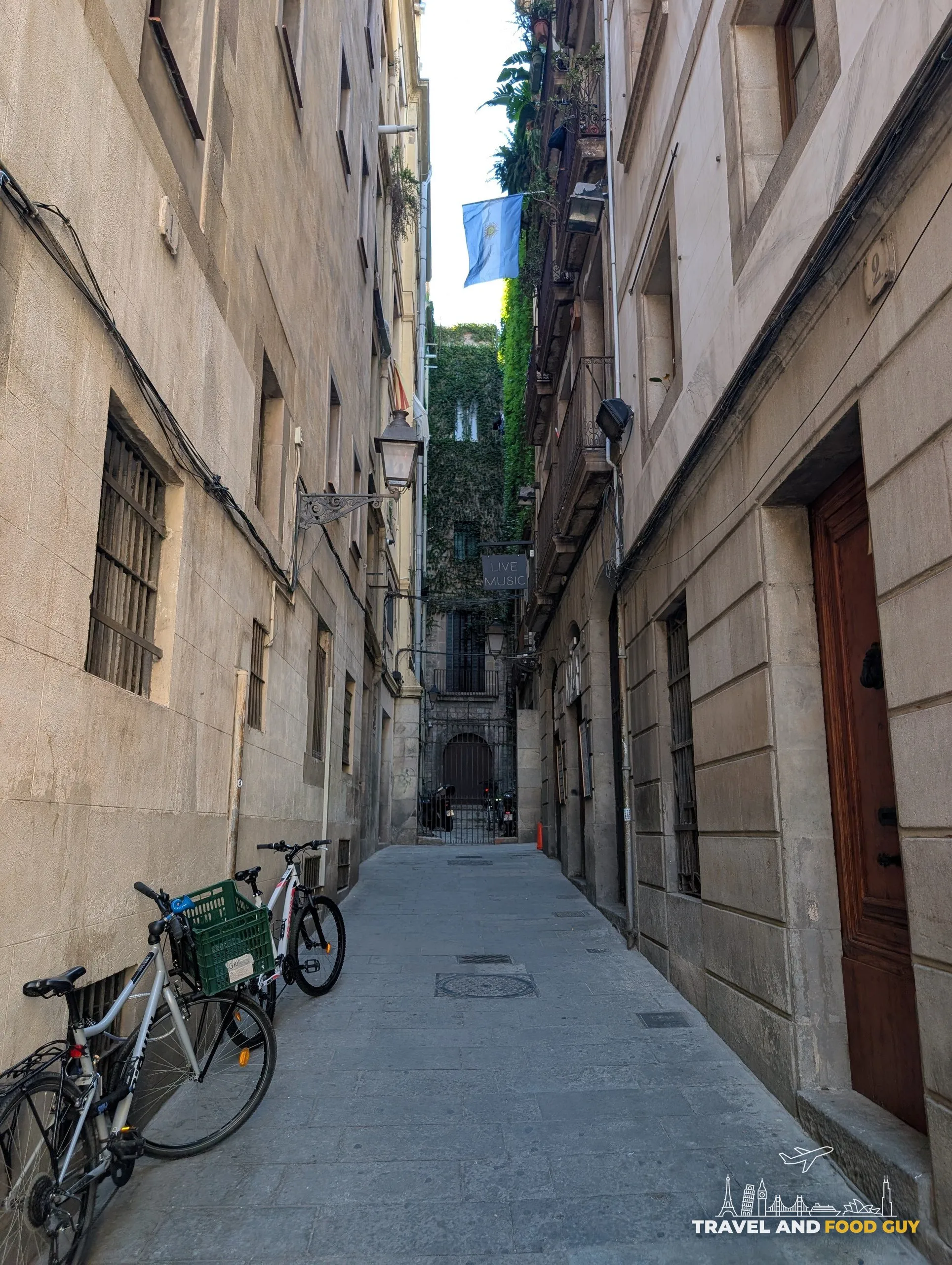 Bicycles parked against a wall in a narrow lane in the Gothic Quarter of Barcelona
