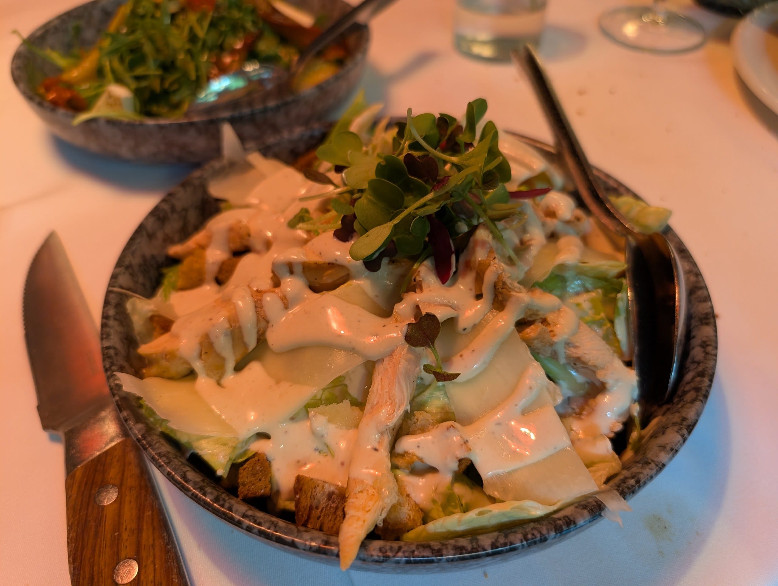 Caesar salad with chicken, croutons and shaved cheese at La Cabrera Barcelona
