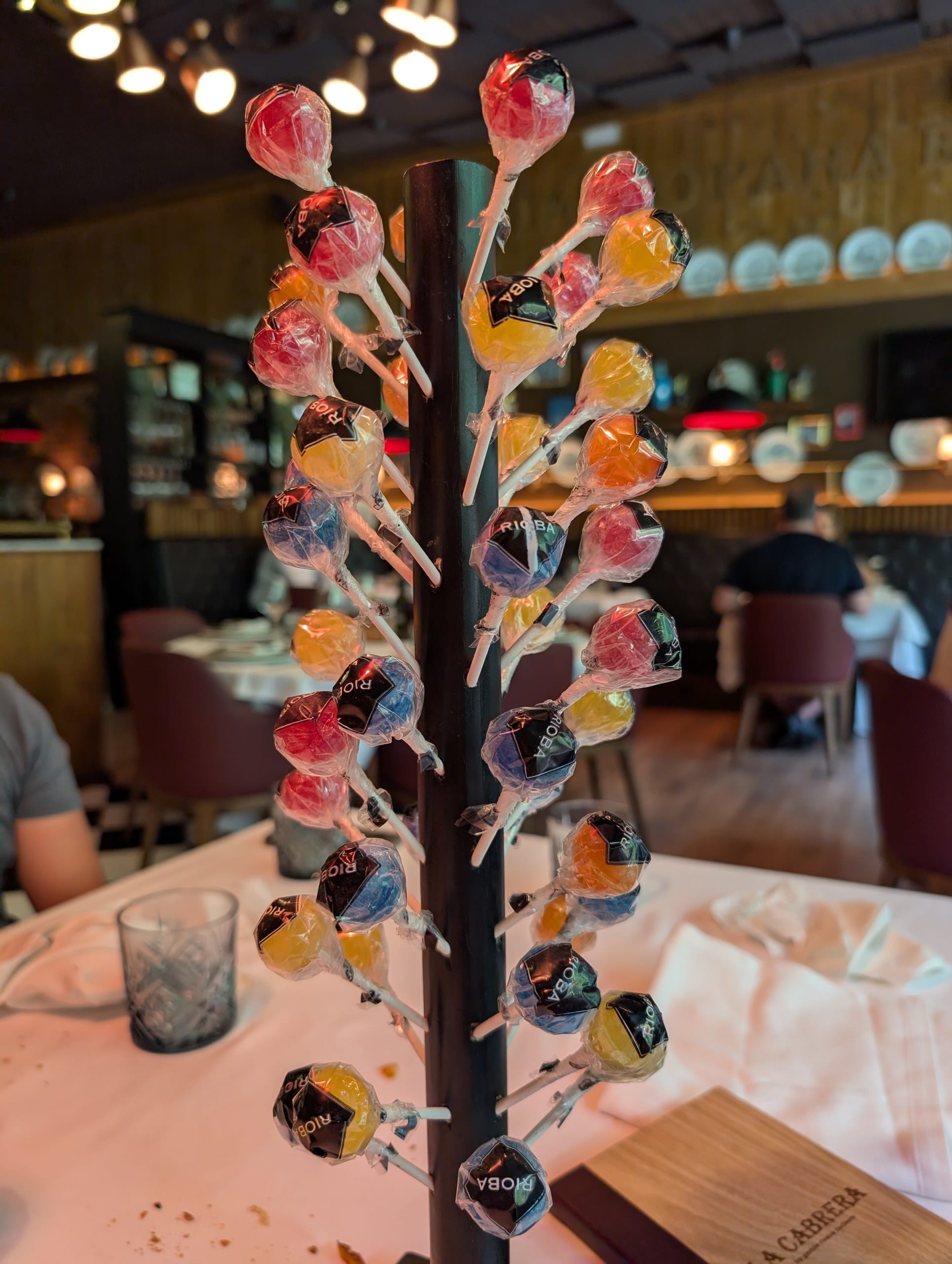The tower of lollipops brought to the table at the end of the meal at La Cabrera Barcelona